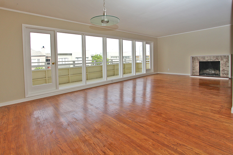 Living room with fireplace and deck
