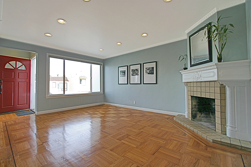 living room has hardwood floors and fireplace